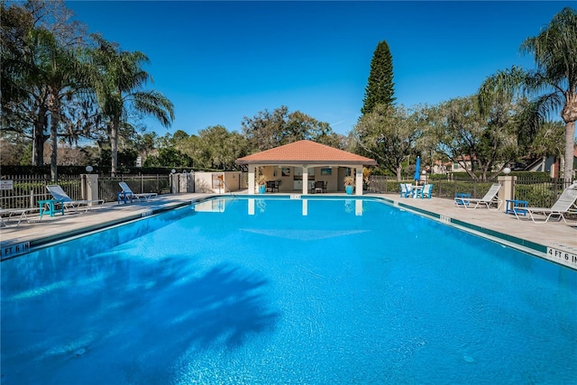 view of swimming pool with a patio