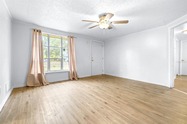 unfurnished room with ceiling fan, crown molding, and light hardwood / wood-style flooring