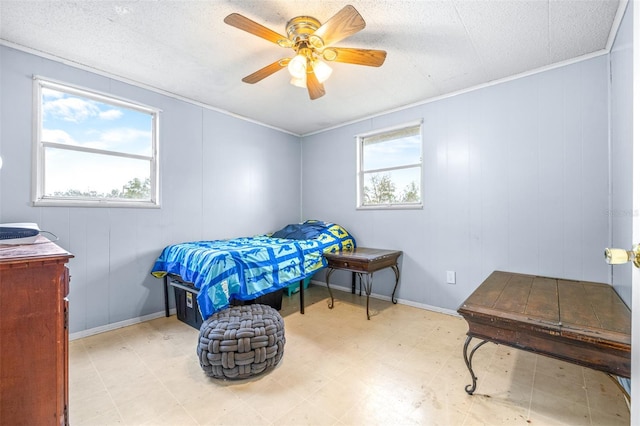 bedroom featuring ceiling fan and crown molding