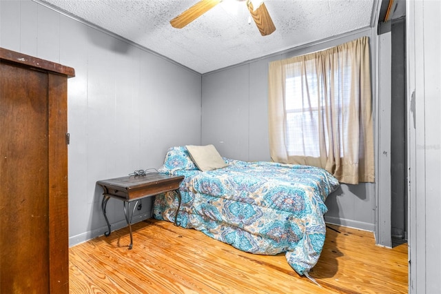 bedroom featuring ceiling fan and hardwood / wood-style flooring