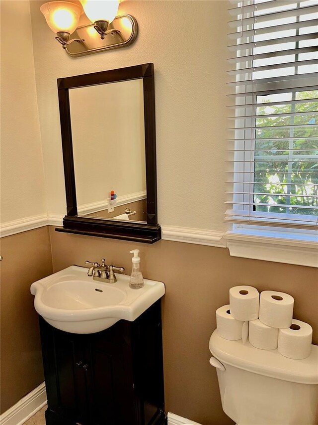 bathroom with vanity and toilet