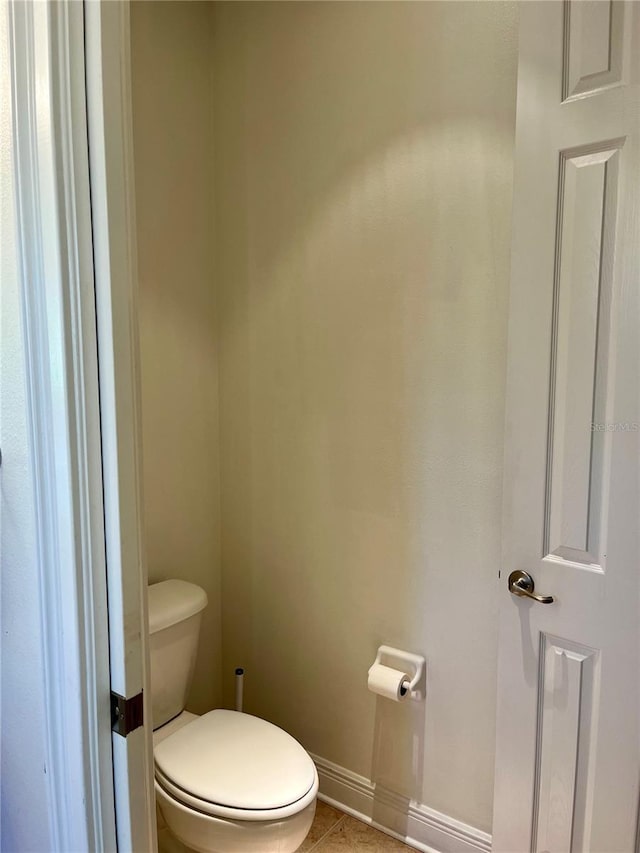 bathroom featuring tile patterned floors and toilet