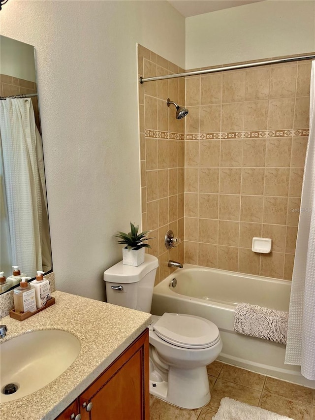 full bathroom with vanity, shower / tub combo, tile patterned flooring, and toilet