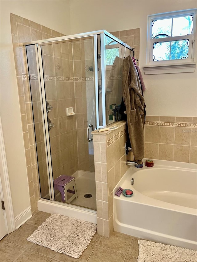 bathroom with tile patterned flooring and plus walk in shower