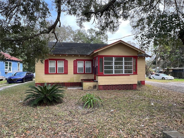 ranch-style home with a front lawn