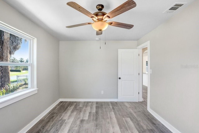 unfurnished room with ceiling fan and light hardwood / wood-style flooring