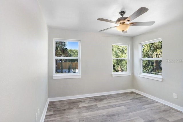 unfurnished room featuring ceiling fan and light hardwood / wood-style flooring