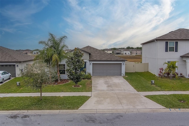 view of front of property with a garage and a front yard