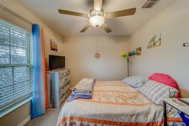 bedroom featuring ceiling fan and carpet flooring