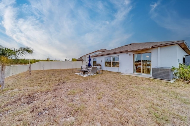 exterior space with cooling unit and a patio area