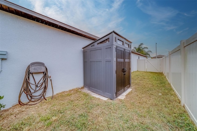 view of outbuilding with a lawn