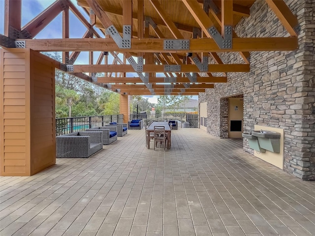 view of patio / terrace featuring a gazebo and an outdoor living space with a fireplace