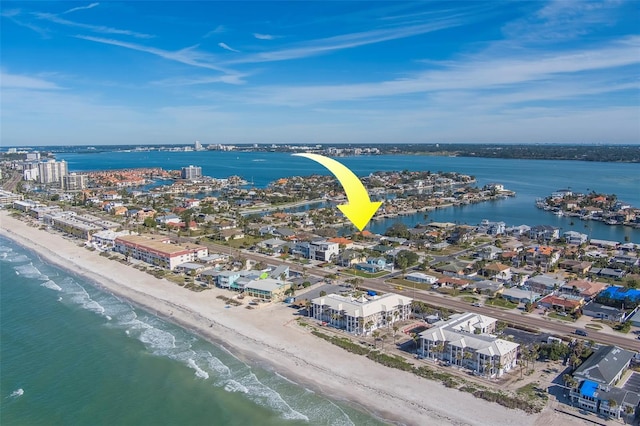 birds eye view of property featuring a view of the beach and a water view