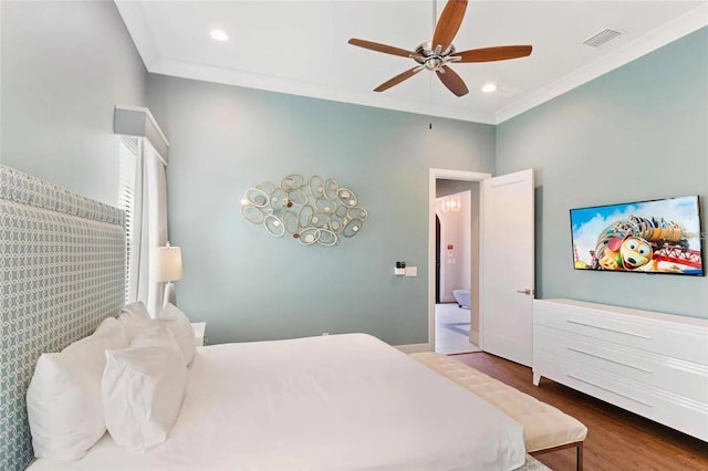 bedroom with ceiling fan, ensuite bathroom, crown molding, and dark hardwood / wood-style floors