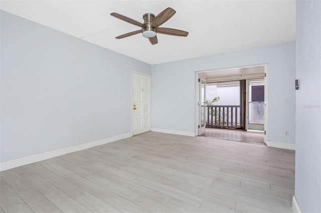 spare room featuring light wood-type flooring and ceiling fan