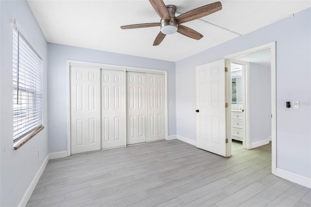 unfurnished bedroom with ceiling fan and light hardwood / wood-style floors