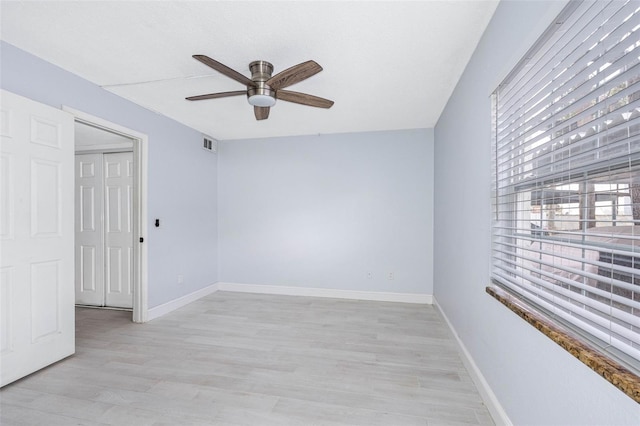 unfurnished room featuring ceiling fan and light hardwood / wood-style floors