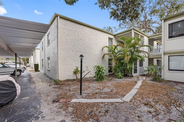 view of home's exterior with a carport