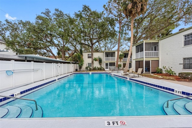 view of pool with a sunroom