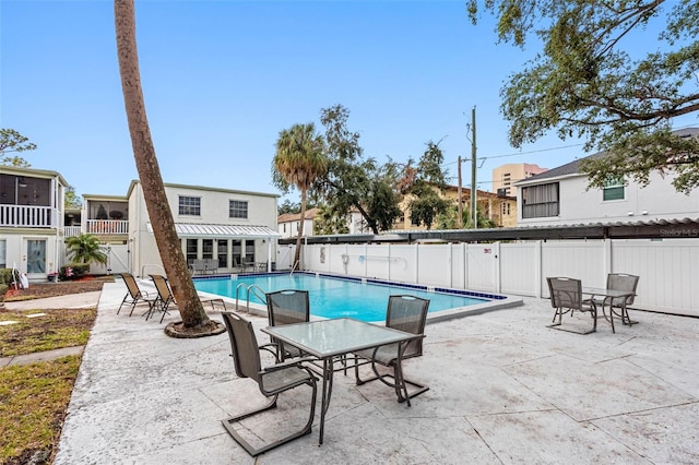 view of swimming pool featuring a patio