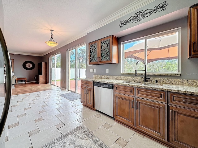 kitchen with crown molding, stainless steel dishwasher, a sink, and a healthy amount of sunlight