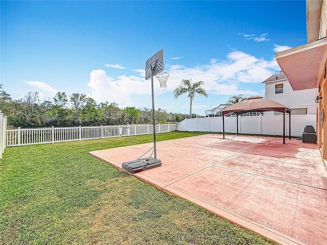 view of basketball court with a gazebo, a lawn, a fenced backyard, and basketball court