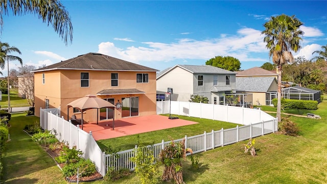 back of property featuring stucco siding, a fenced backyard, a yard, and a patio