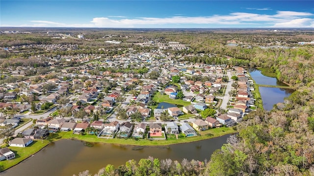 birds eye view of property with a residential view and a water view