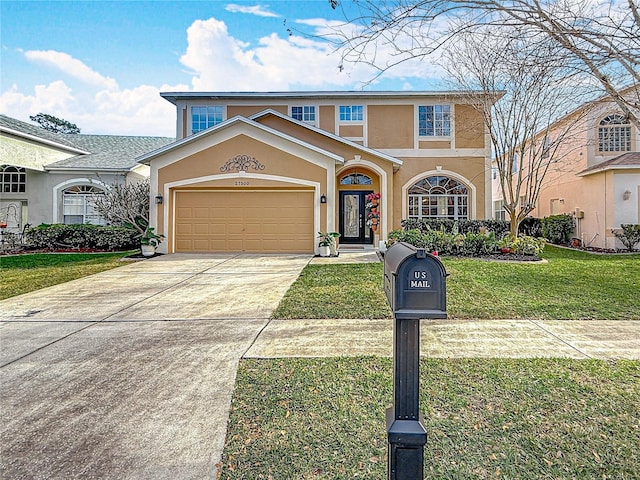 mediterranean / spanish-style house with an attached garage, stucco siding, concrete driveway, and a front yard