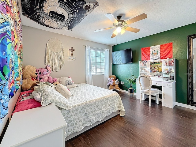 bedroom featuring baseboards, a ceiling fan, a textured ceiling, and dark wood-style floors