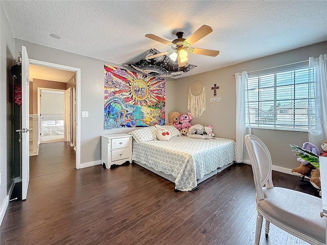 bedroom featuring a textured ceiling, ceiling fan, baseboards, and dark wood-type flooring