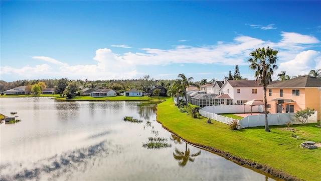 property view of water with a residential view and fence