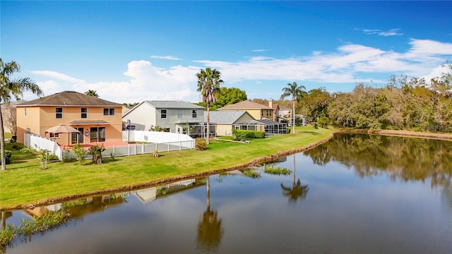 property view of water featuring fence