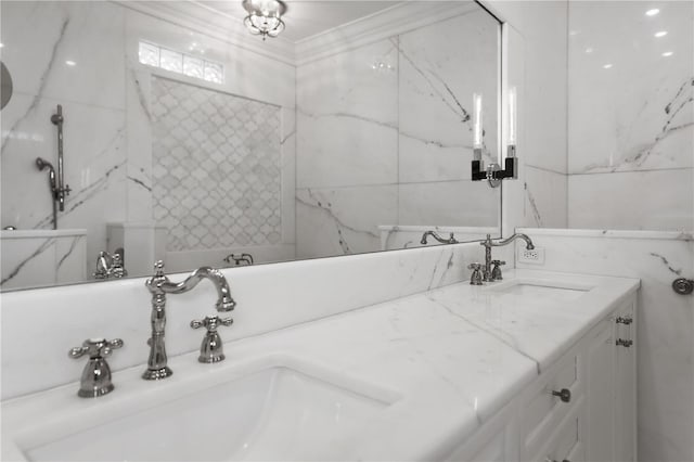 bathroom featuring ornamental molding and vanity