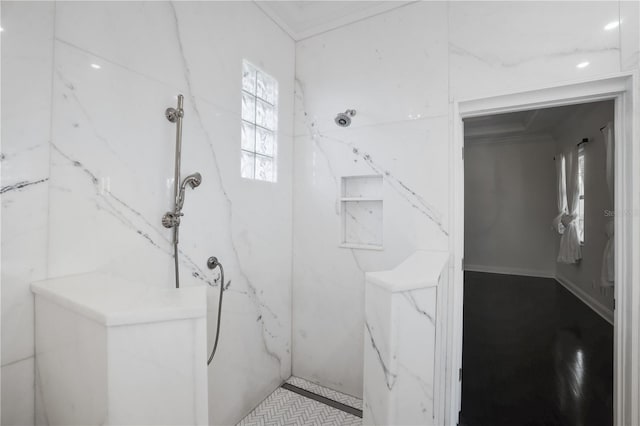 bathroom featuring a shower and ornamental molding