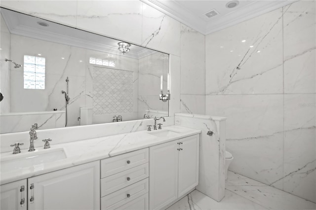 bathroom with toilet, vanity, and ornamental molding