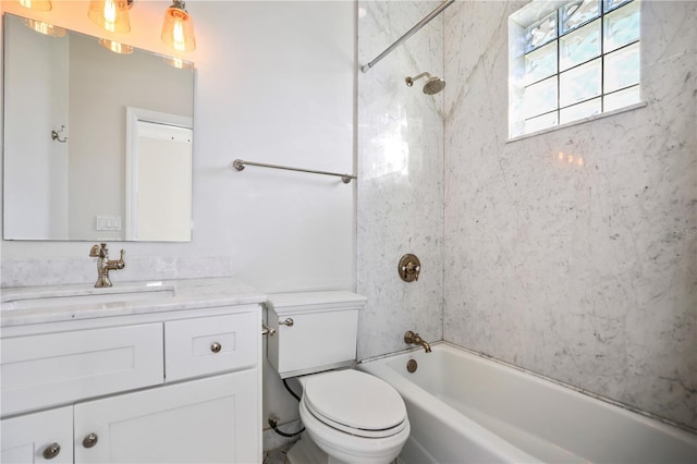 full bathroom with toilet, tiled shower / bath combo, and vanity