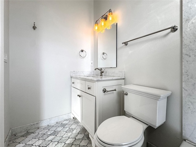 bathroom with toilet and vanity