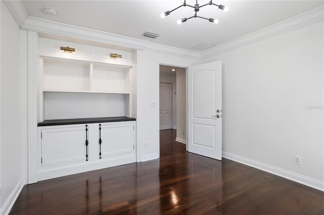 unfurnished bedroom with dark hardwood / wood-style floors and crown molding