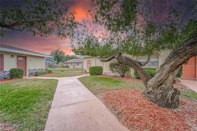 view of front of home featuring a yard