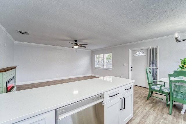 kitchen featuring white cabinets, stainless steel dishwasher, light hardwood / wood-style floors, and crown molding