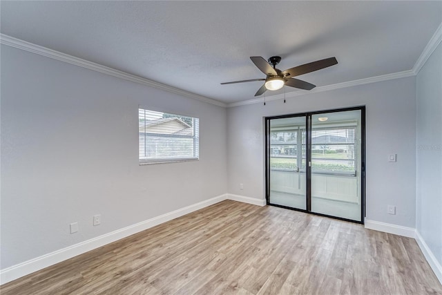 spare room featuring ceiling fan, light hardwood / wood-style flooring, and ornamental molding