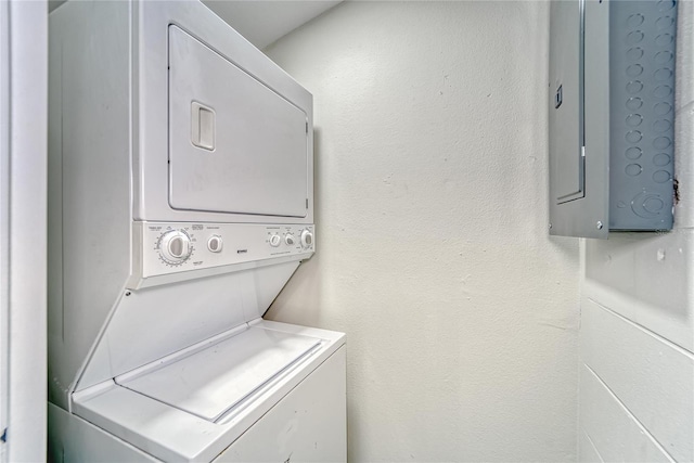 washroom with stacked washer and dryer