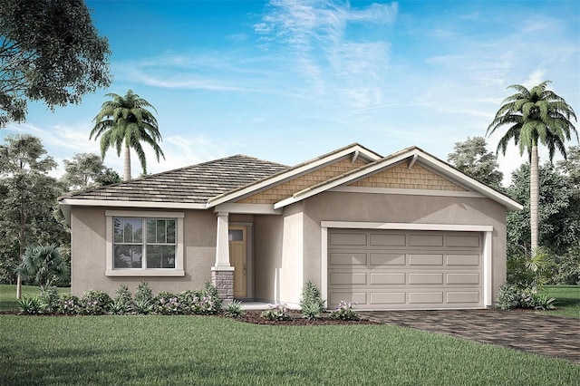 view of front of property with a front lawn and a garage