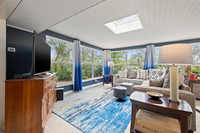 tiled living room featuring a skylight