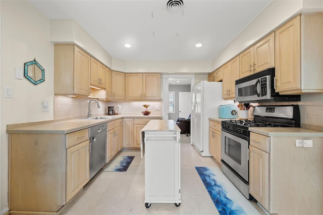 kitchen with a kitchen island, sink, backsplash, stainless steel appliances, and light brown cabinets