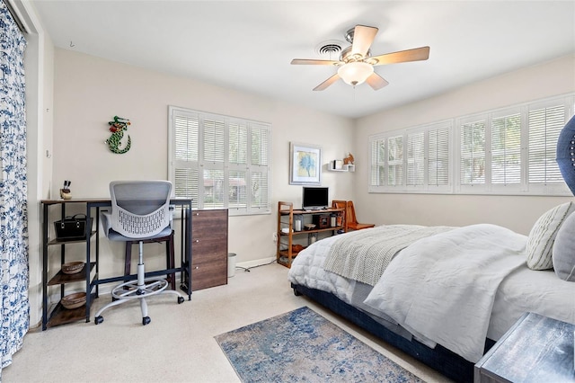 bedroom featuring ceiling fan and light colored carpet