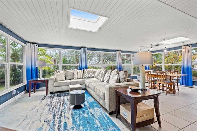 sunroom featuring a skylight and rail lighting