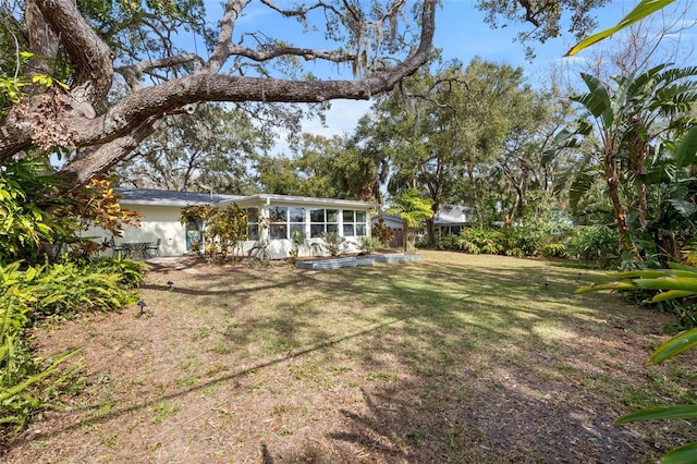 view of yard featuring a sunroom