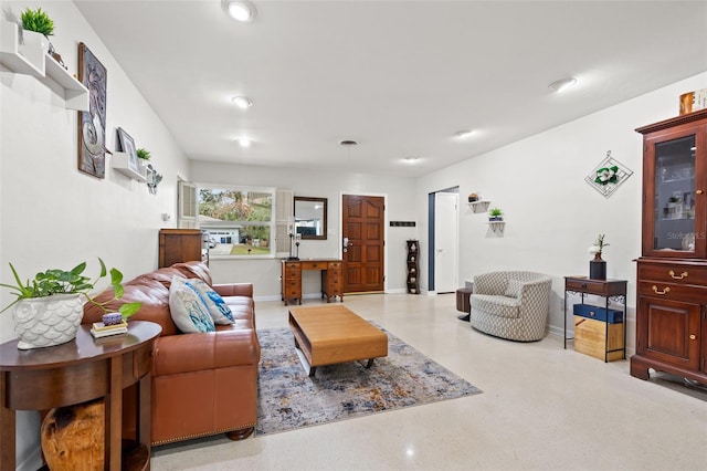 living room featuring baseboards